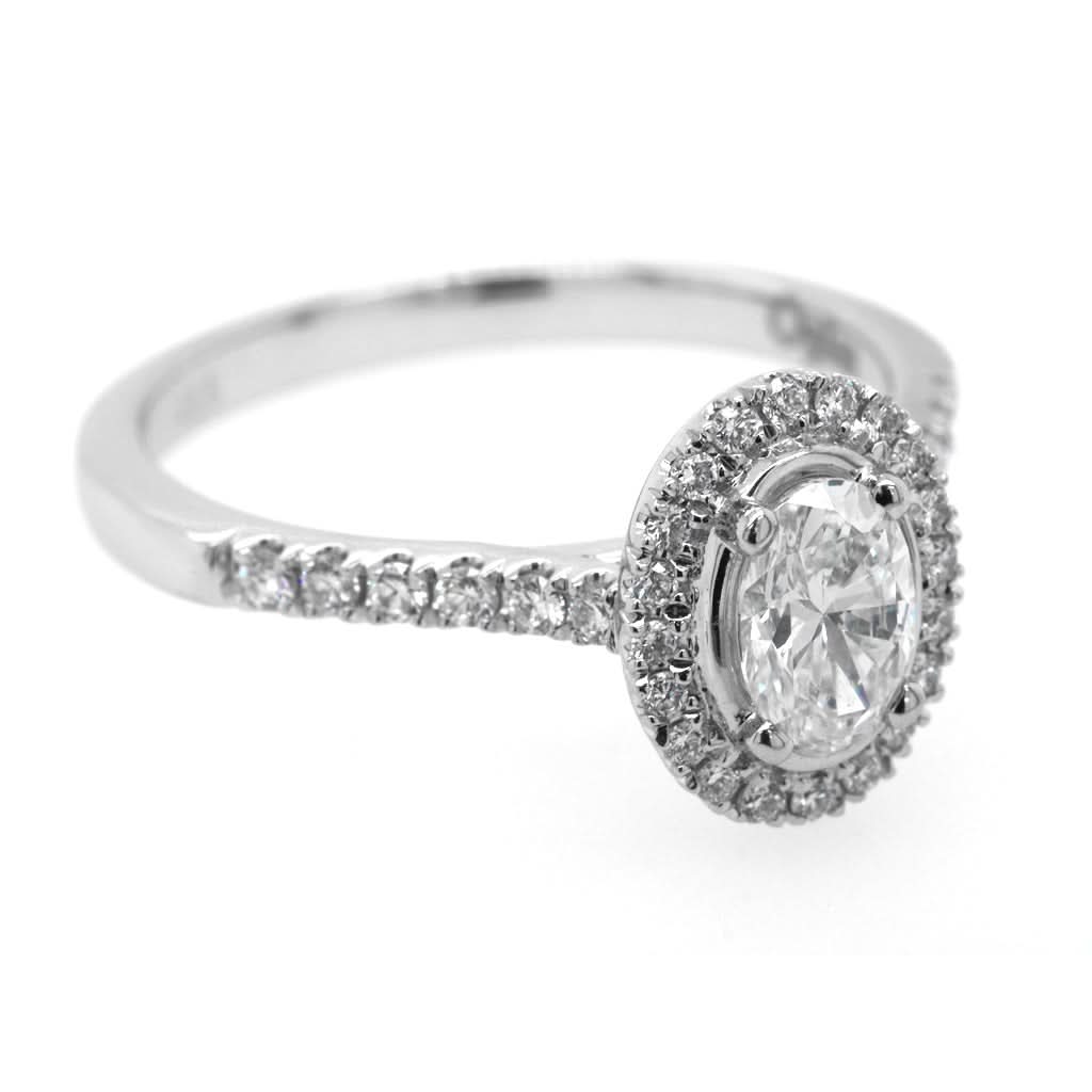 A Platinum Oval Diamond Cluster Ring with Diamond Shoulders - Image 2